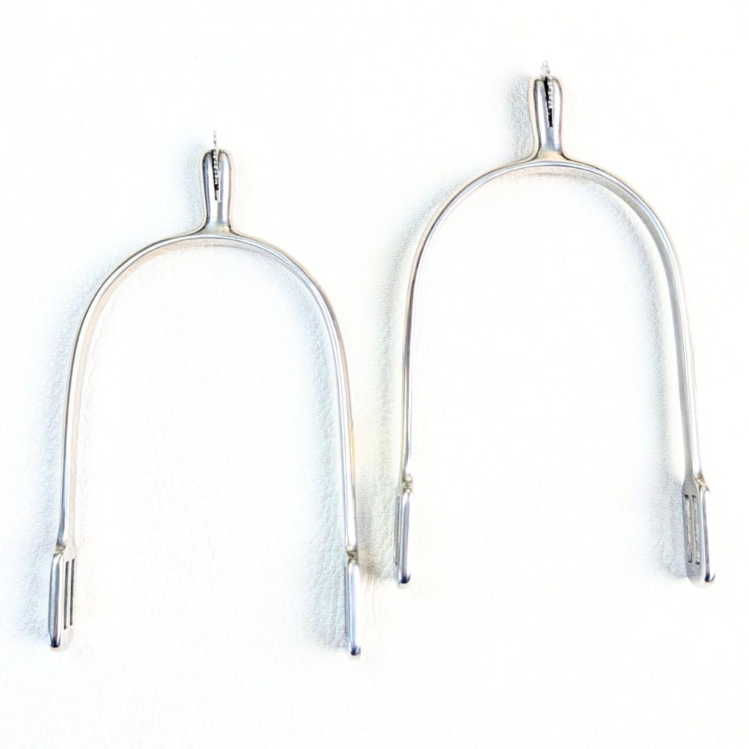 silver english spurs on a white background