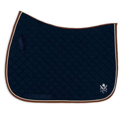 Navy blue quilted saddle pad with cognac binding and cream piping  on a white background