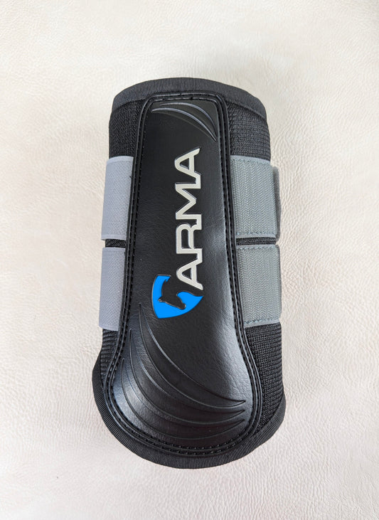A single black and gray ARMA brushing boot on a light textured background, highlighting the molded strike pad and vertical ARMA logo.