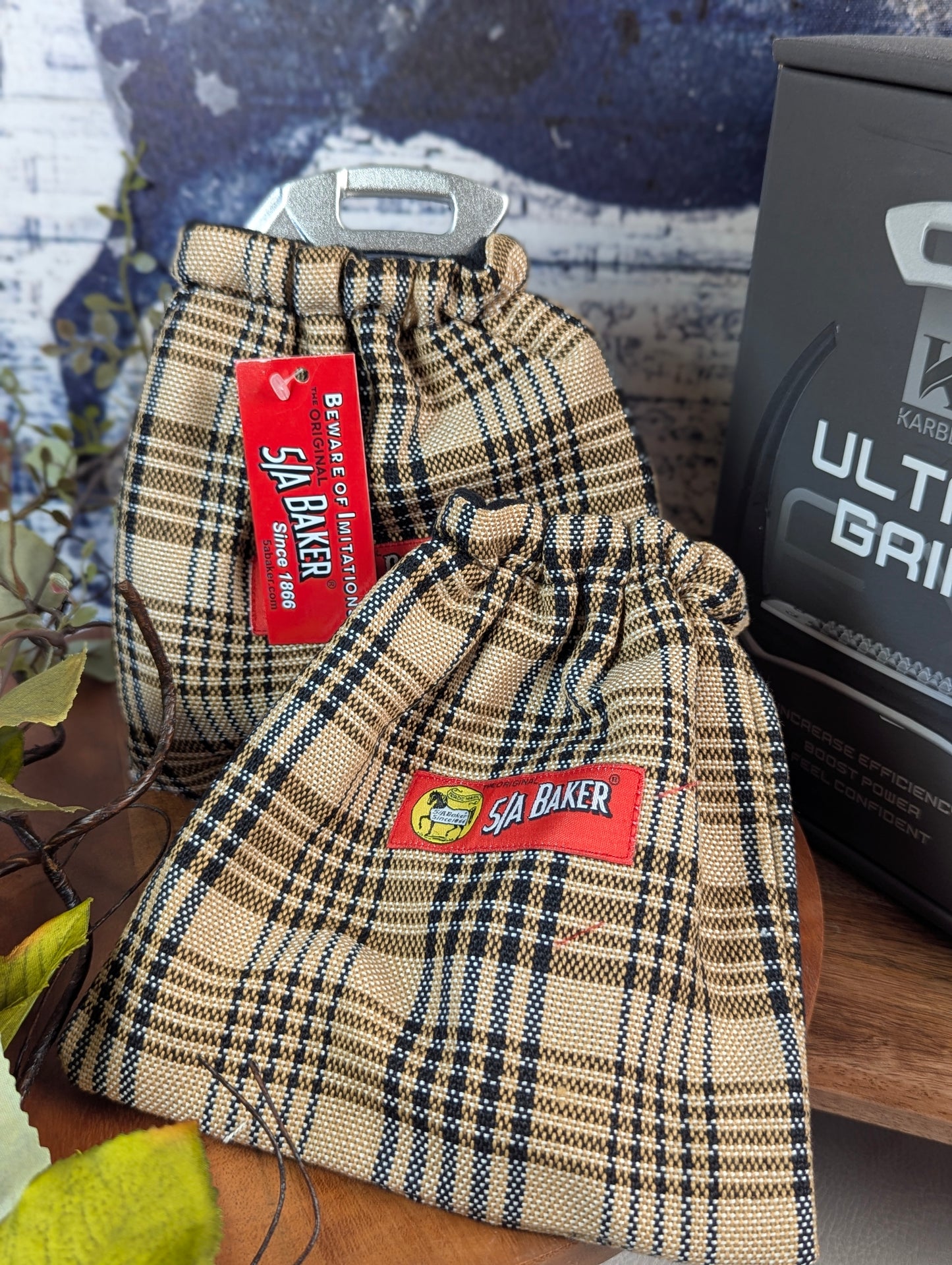 plaid english stirrup covers with the 5a baker red tag logo