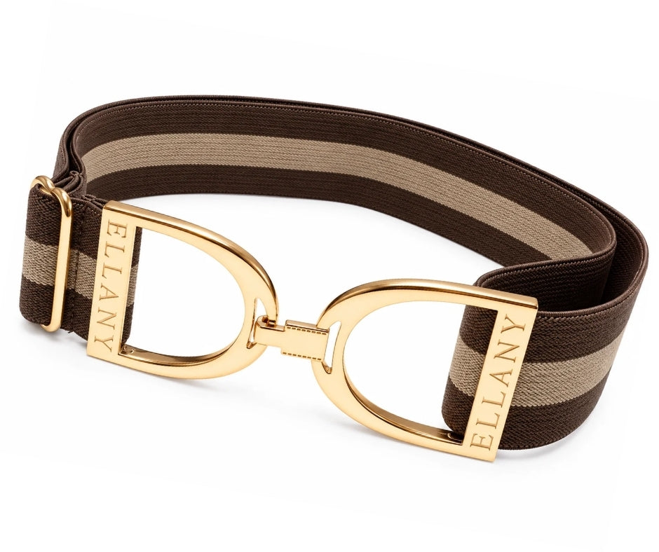 Brown striped elastic belt with polished gold Ellany stirrup buckle, styled in warm earthy tones.