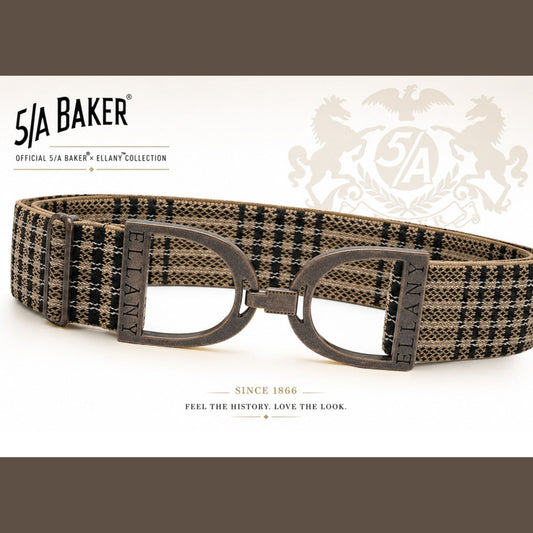 A 51A Baker Ellany collection belt with a brown and black plaid pattern, featuring dark metal D-rings and a matching buckle, displayed on a white background with brand logos.