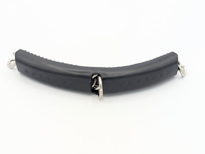   
Black Horsena gel curb chain cover with integrated metal rings and center joint, designed to cushion curb pressure and prevent jaw irritation on sensitive horses.