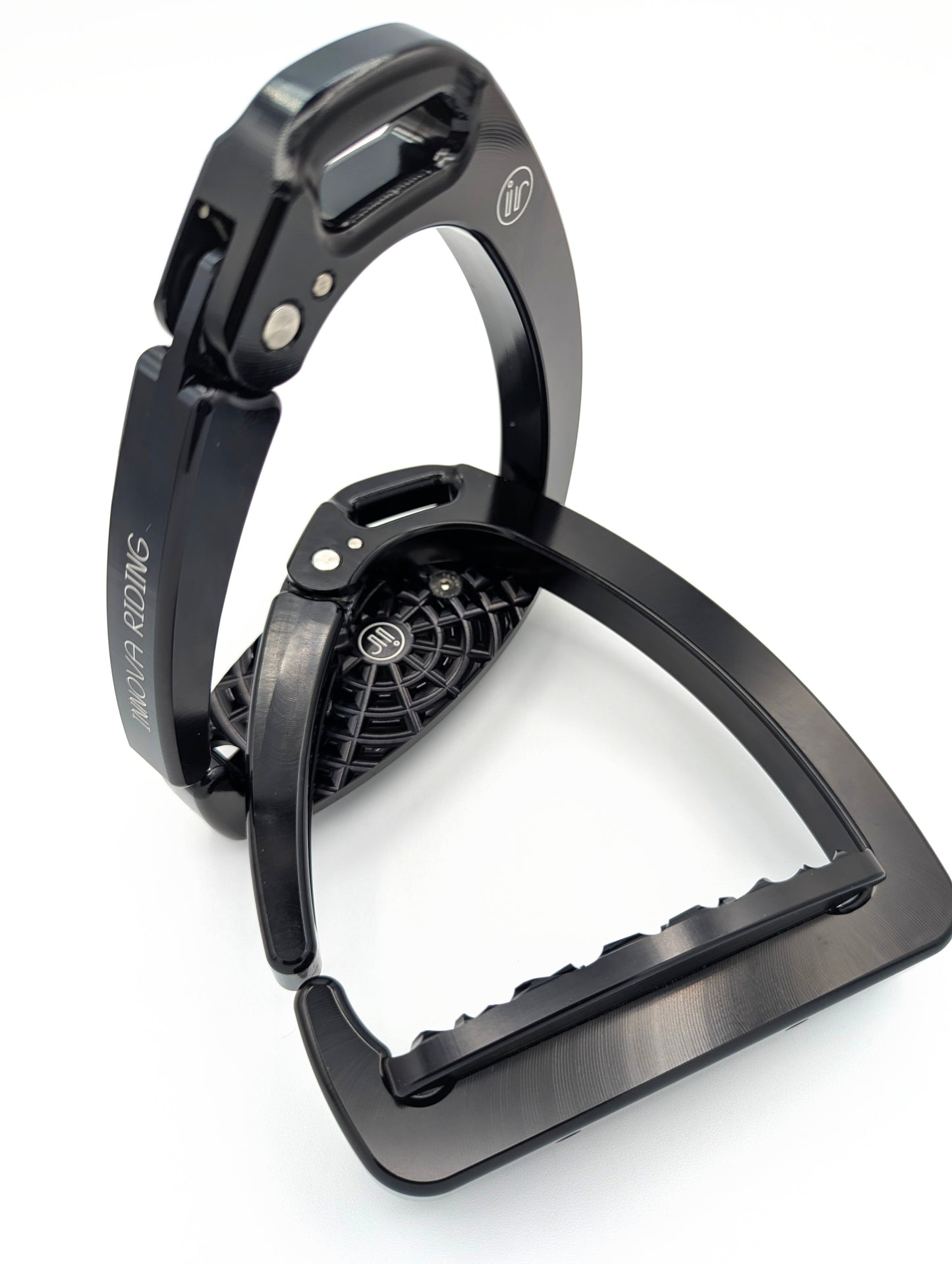 Lightweight aluminum Olympia safety stirrups with quick‑release arm and high‑grip tread. Modern black finish for dressage or jumping performance.