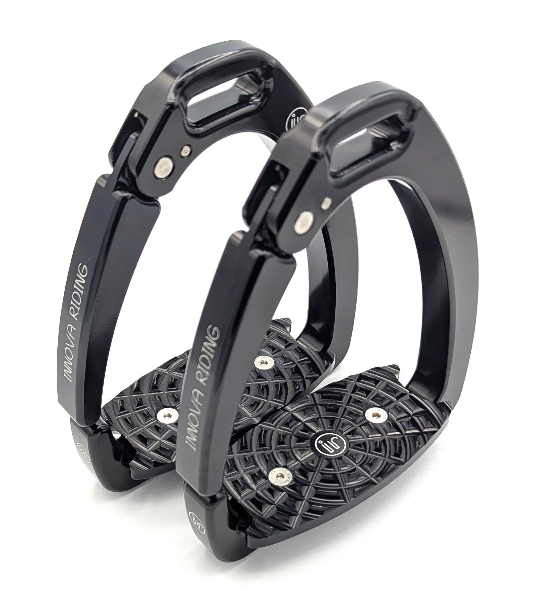 Pair of black Innova by Tech Stirrups Olympia safety stirrups with textured aluminum tread and modern open‑arm design, shown in a matte black finish.