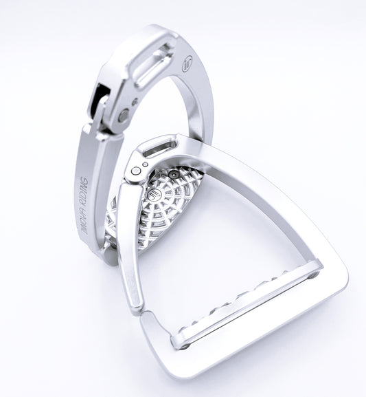 Silver Olympia safety stirrups crafted from lightweight aluminum with quick‑release arm and high‑grip tread. Italian design for dressage or jumping.