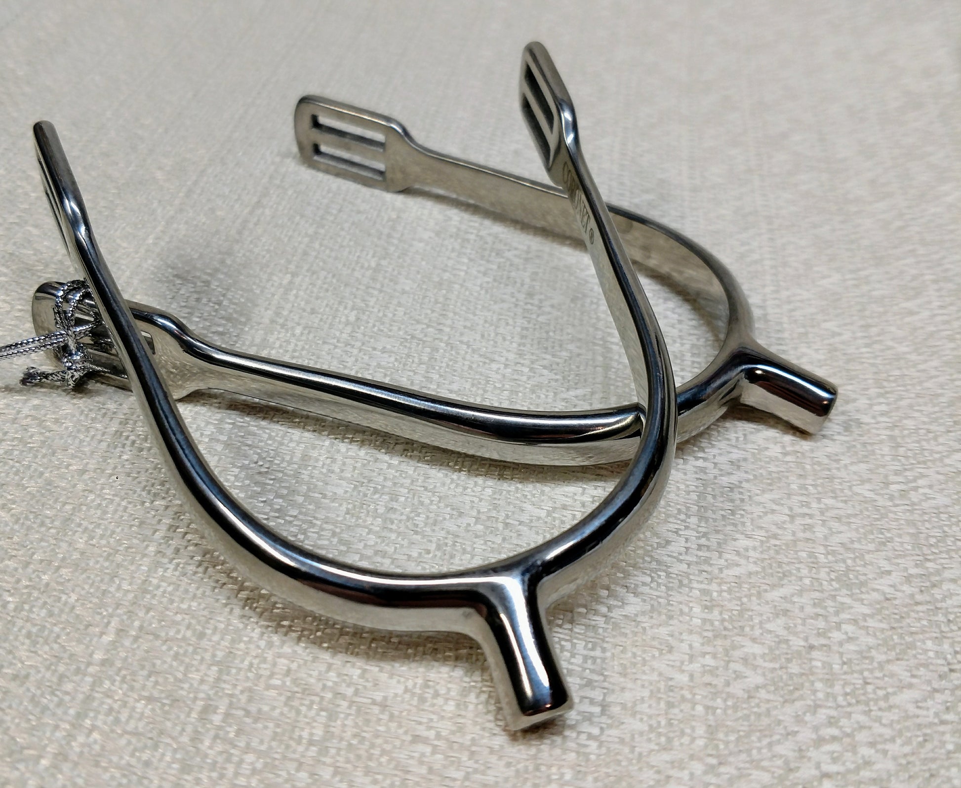 Stainless steel ladies POW spurs with 10mm neck and easy‑insert square‑slot strap design, lightweight and shaped for women riders.