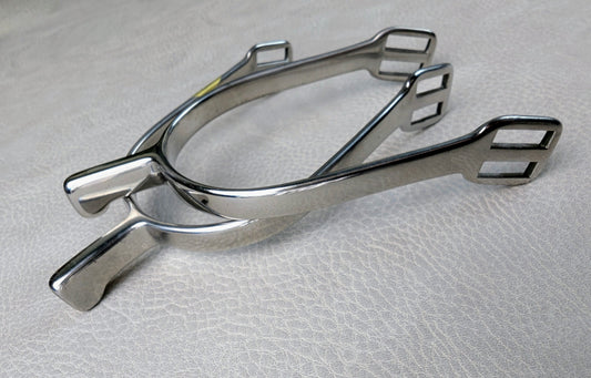 Stainless steel ladies hammerhead spurs with 25mm neck and rounded ends, shown on a light textured surface.
