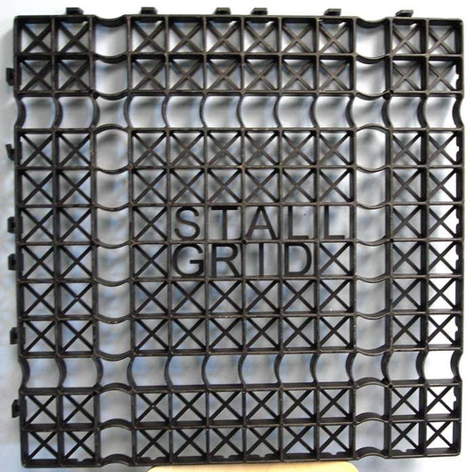 Interlocking Stall Grid flooring panel showing structural cross‑supports and raised “STALL GRID” logo.