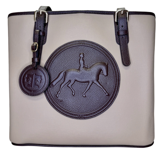 Handbag with dressage horse and rider emblem on a sand background