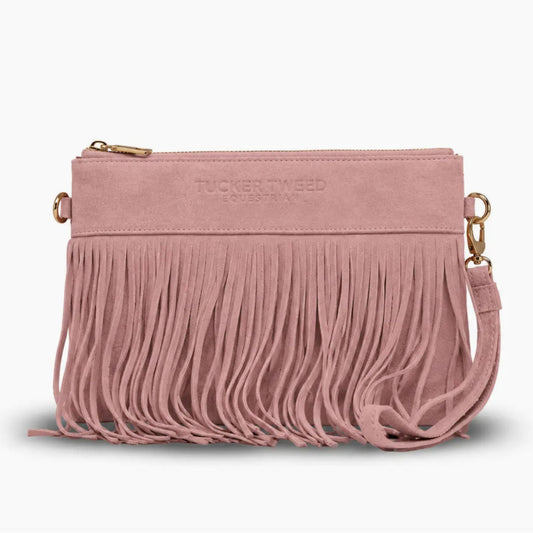 A dusty pink suede fringe clutch bag with gold-tone hardware and a top zipper, featuring the brand name 'TUCKER TWEED' debossed on the front.