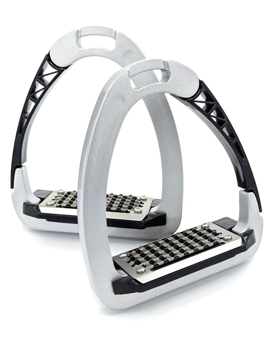 Pair of TuffRider Tech Safety Stirrups displayed upright, featuring silver frames, black polymer release arms, and grated metal footbeds for secure rider grip.